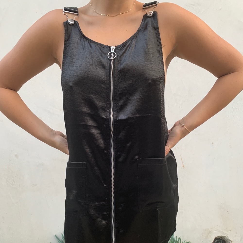 Sleek black zip up dress with hook straps